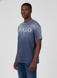 Man wearing a blue t-shirt with 'APOLLO' text on a white background