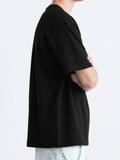 Person wearing a black t-shirt on a white background