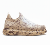 Side view of beige knit Torino Light Brown Peak sneakers with brown hand-painted splatter detailing.