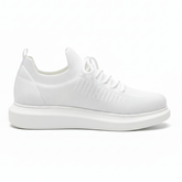 Side shot of pair of white knit Torino sneakers with a thick sole and laces, designed by Apollo Moda.