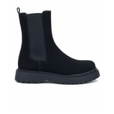 Side view of Zenith Midnight Chelsea Boots by Apollo Moda in black suede with black elastic panels and a chunky sole.