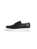 Black leather sneaker with white sole on a white background