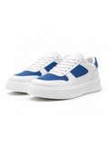 White sneakers with blue accents on a white background
