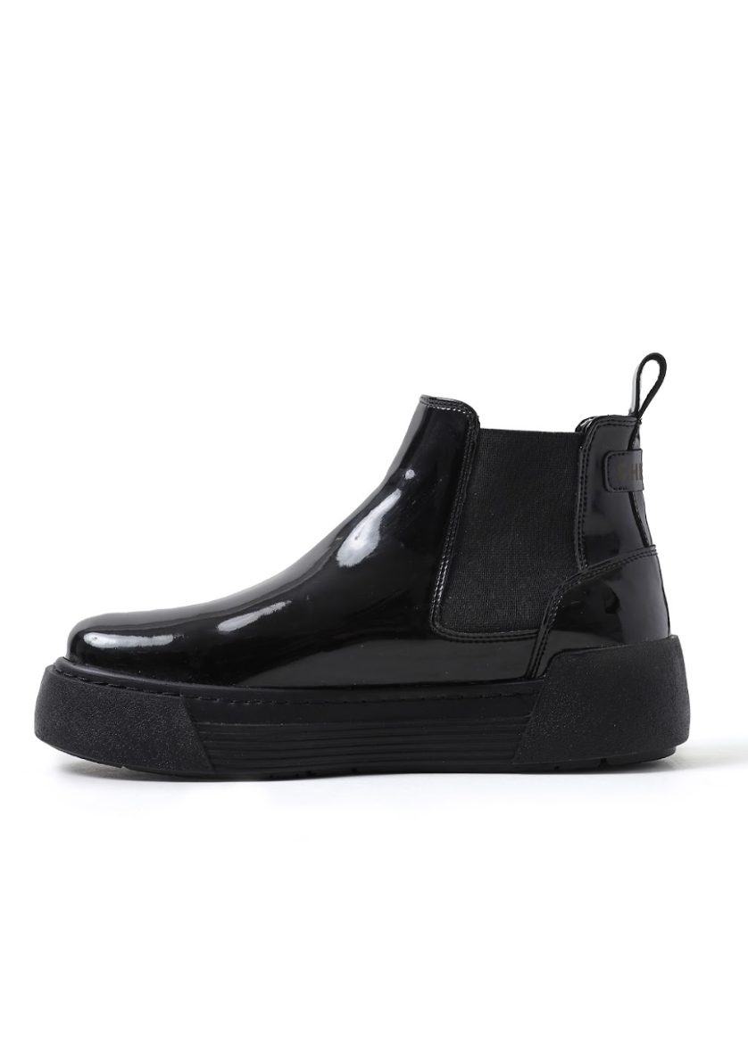 Side profile of black patent Avalon Chelsea Apollo boots with cushioned platform sole.