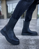 Lifestyle shot of Zenith Alaska Chelsea Boots by Apollo Moda in textured black leather with matching elastic panels and black soles.