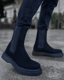 Lifestyle shot of Zenith Midnight Chelsea Boots by Apollo Moda in black suede with matching elastic panels and thick black soles.